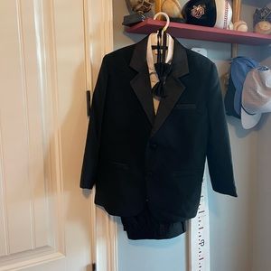 Tux includes tuxedo shirt, pants, jacket, vest, bow tie, cummerbund. Size 10.